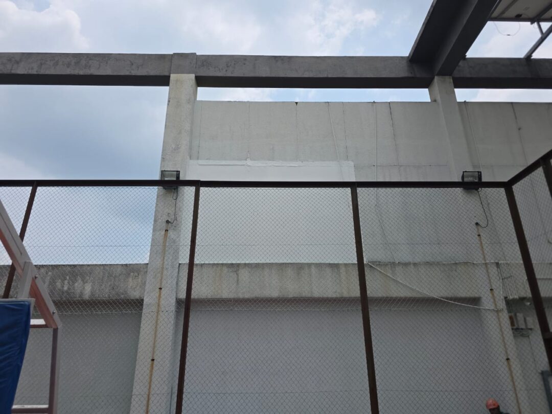 Cement board wall panels after replacement, showing a clean uniform surface with no rust staining